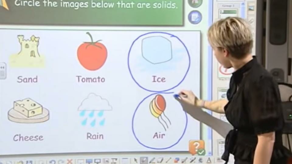 teacher showing how smartboard works
