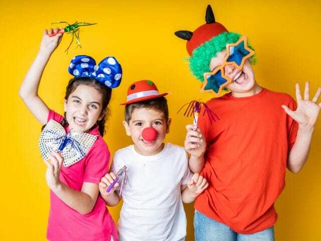 group of children wearing photo booth props